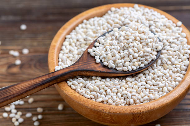 istock Pearl barley in bowl close-up. 1358209380