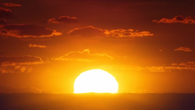 Africa. African timelapse sunrise. Sun inferior mirage.