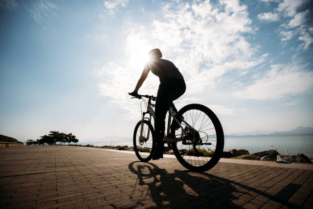 istock Riding bike on the sunrise coast path 1358212889
