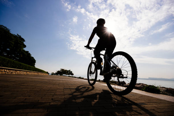 istock Riding bike on the sunrise coast path 1358212936