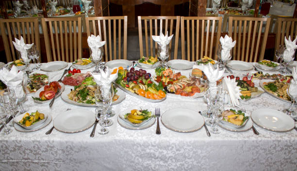 istock Photo of a festive table with a white tablecloth and snacks. 1358213066