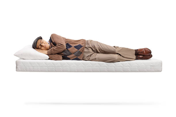 istock Senior man sleeping on a floating matress 1358214692