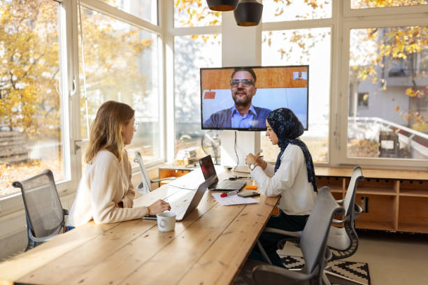 istock Business colleagues having a video conference at startup office 1358218214