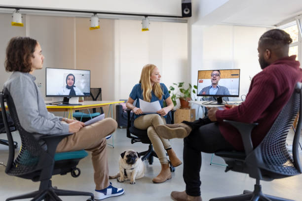 Entrepreneurs having hybrid meeting at startup office