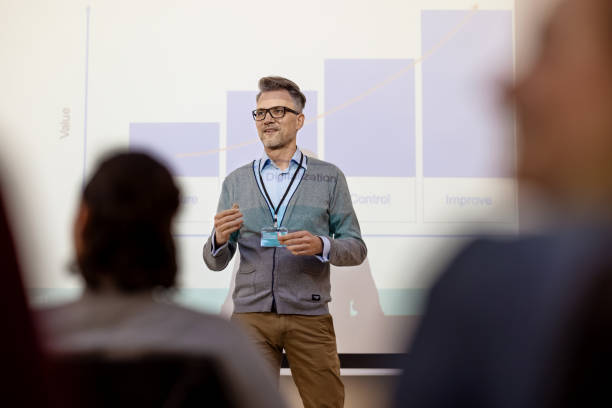 istock Confident businessman giving presentation in launch event 1358219315