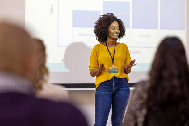 Woman entrepreneur presenting at business seminar African businesswoman sharing statistics and growth rate during a conference. Female entrepreneur presenting at business seminar. presentation speech stock pictures, royalty-free photos & images