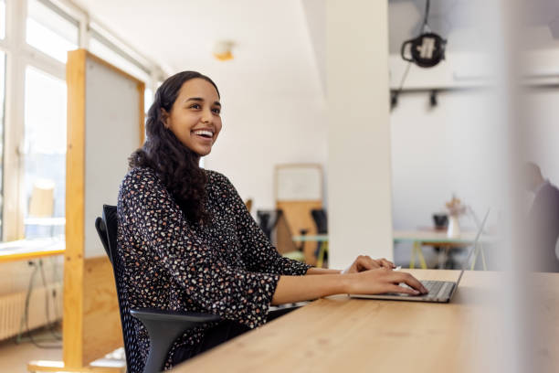 istock Happy business woman working at startup office space 1358219534