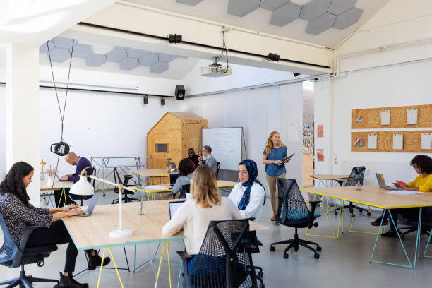 istock Business people working at a modern coworking office 1358219573