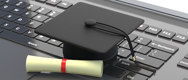 College University studies online. Education, graduation and e learning. Mortarboard and diploma on a computer keyboard. 3d illustration