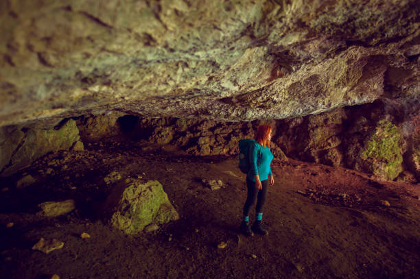 istock Mountain lover explores a new cave 1358225068