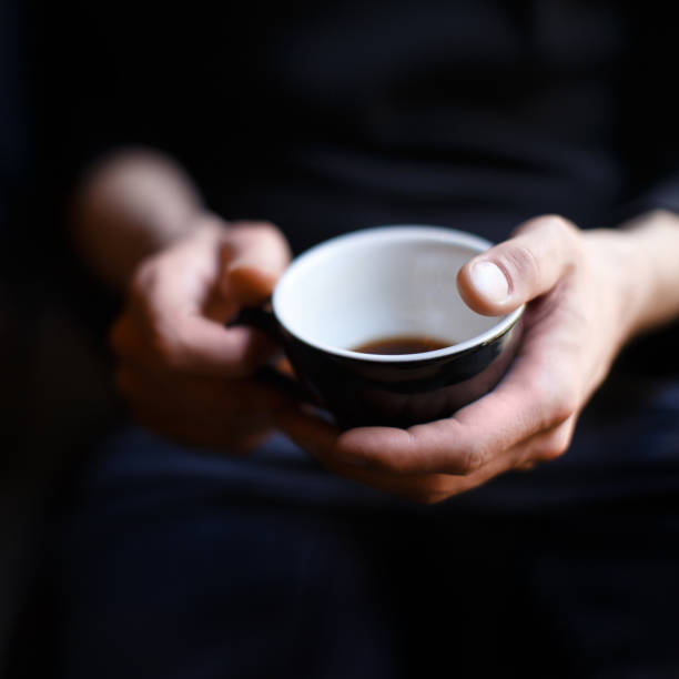 Man holds cup of coffee in his hands