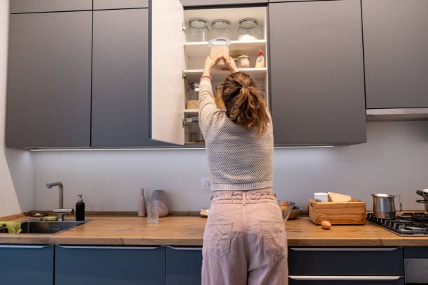 istock Woman baking bread at home 1358225643