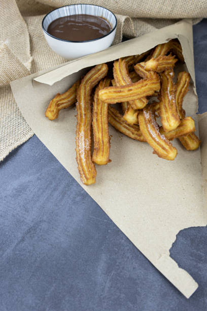 istock churros, with chocolate, sugar,  traditional recipe 1358226874