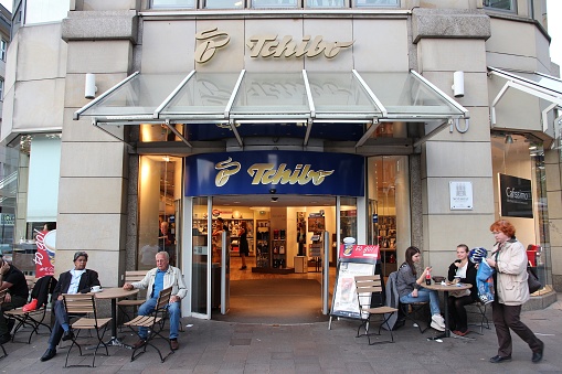 People visit Tchibo shop and cafe in Hamburg. With more than 1,000 stores, Tchibo is among Germany's largest retail chains.