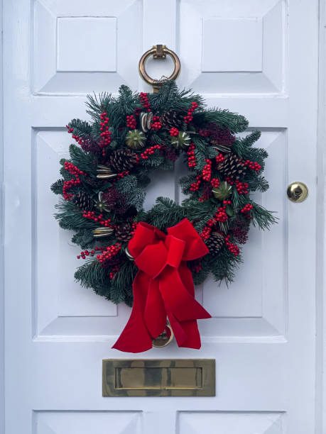 istock Christmas wreath on light grey door 1358228400