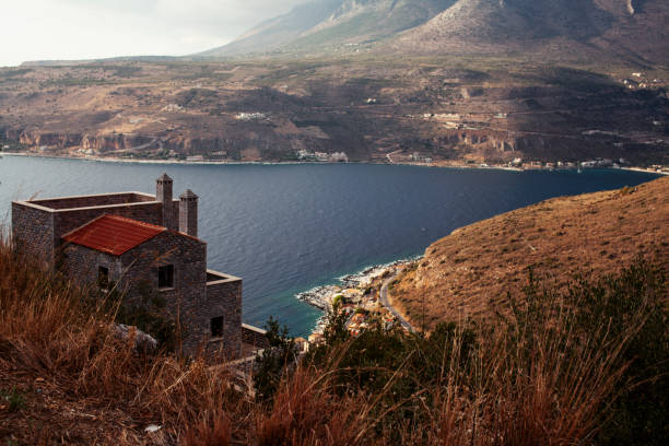 istock Beautiful greek landscape: seashore with mountains and clouds 1358230634