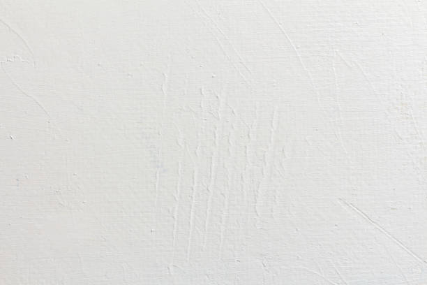 istock Textured white wall covered with acrylic paint as a background 1358231762
