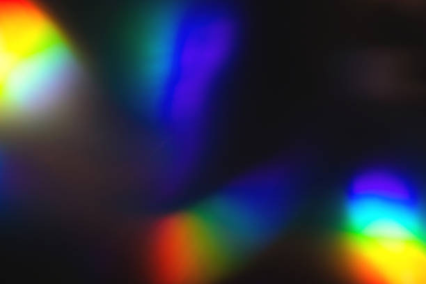 istock colorful rainbow crystal light leaks on black background 1358233197
