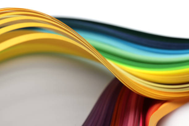 istock Abstract rainbow gradient color wave curl strip paper background. Soft focus. 1358233765