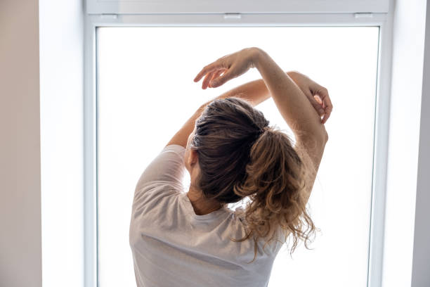 istock Woman relaxing at home - the Feldenkrais method 1358233989