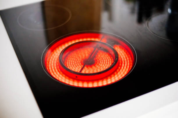 Electric ceramic hob with red hot plate stock photo