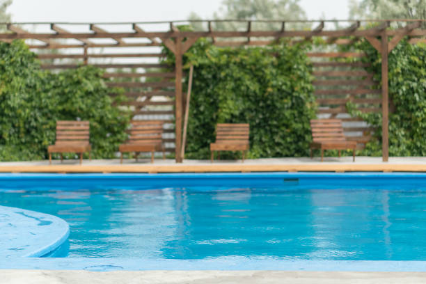 istock Patio and blue water pool. 1358238589
