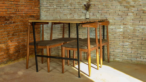 istock A room with a table and chairs, Brick wall. 1358238846