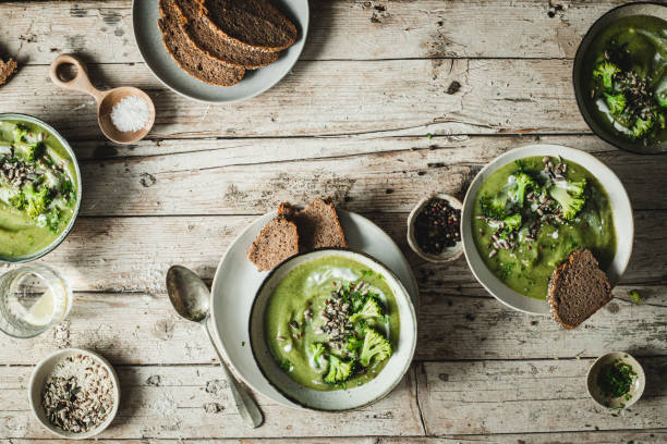 istock Top view of a table with fresh broccoli soup 1358239962