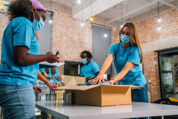 istock Young team of volunteers working together 1358240341