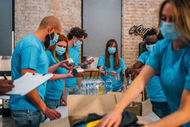 istock Young team of volunteers working together 1358240744