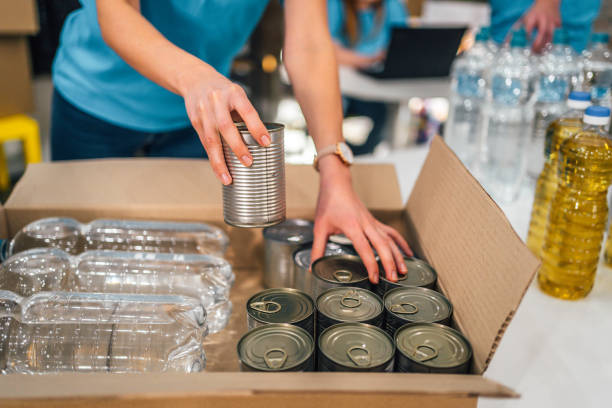 istock Volunteers in charity donations center 1358241688