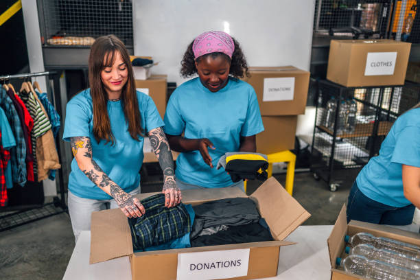 istock Volunteers in charity donations center 1358241786