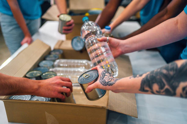 istock Volunteers packing food 1358241994