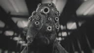 istock Black and white vintage sci-fi alien creature with many glowing eyes. Beholder. Mutant. 1358242035
