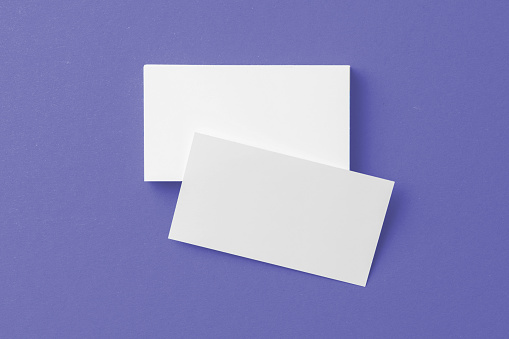 Blank paper business mock up on purple background, copy space