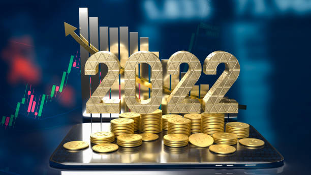 istock The 2022 gold text business chart and gold coins on tablet 3d rendering 1358243959