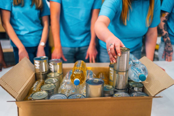 istock Volunteers packing food 1358244268