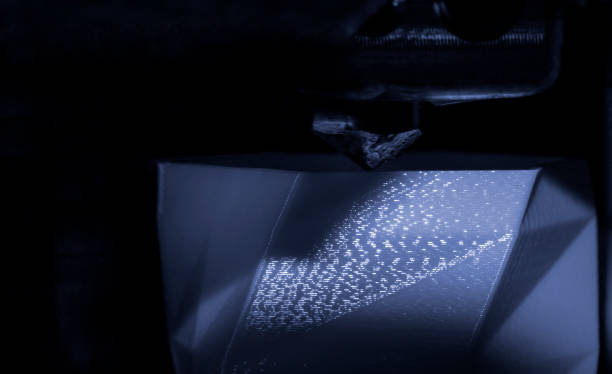 istock 3D printer works and creates an object from the hot molten plastic 1358244805