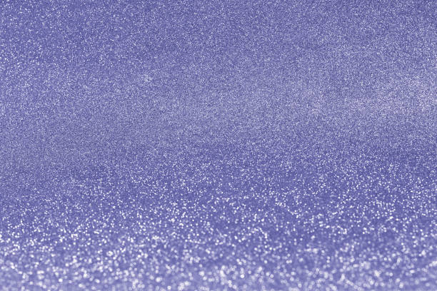 istock festive glitter bright glowing background blur, de-focused design copy space Toned in color of the year 2022 1358246325