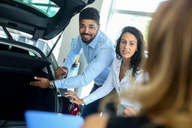 istock Couple buying a hatchback 1358247041