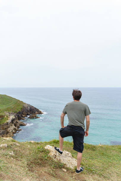 istock Vertical view of unrecognizable traveler man sightseeing in Santa Justa cliffs. 1358247192