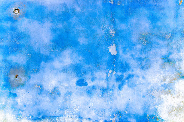 istock Wall background blue. Old rough stone on cement pattern wall background. Vintage grunge plaster or concrete stucco surface. Art rough stylized texture banner with space for text. 1358249209
