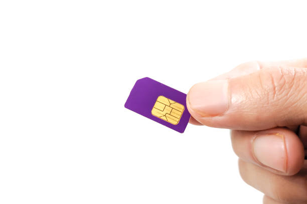 man's hand holding and showing a mini sim card