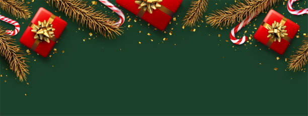 istock Striped candy cane sticks with golden spruce branch and gift box. 1358253446