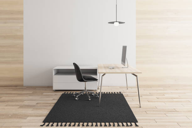 istock Modern minimalistic wooden office interior with empty mock up place on wall, workplace, carpet, furniture and computer device. Style and design concept. 3D Rendering. 1358255325