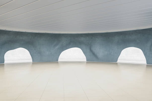 istock Creative concrete cave interior with reflections on white floor. Museum and exhibition concept. 3D Rendering. 1358255383
