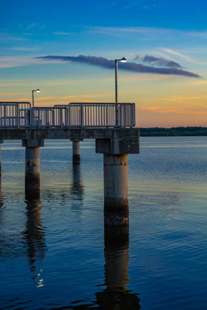istock Pier over the Gulf of Mexico at sunset 1358257302