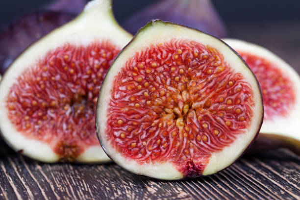 istock ripe purple figs on a wooden table 1358259560