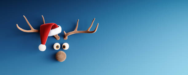 istock Reindeer with Santa hat on blue Christmas background 1358263506