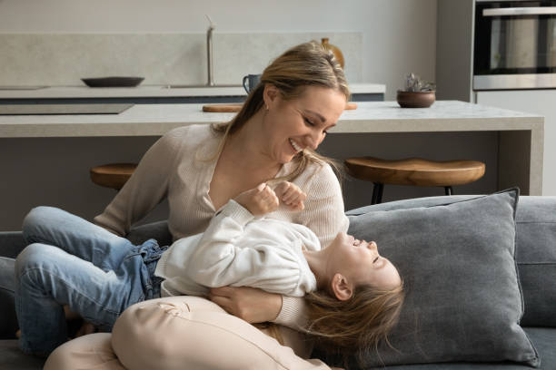 istock Happy young mother playing with little daughter. 1358265927